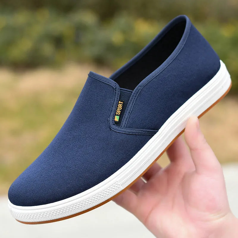 Men's black slip-on canvas shoes with round toe and composite sole