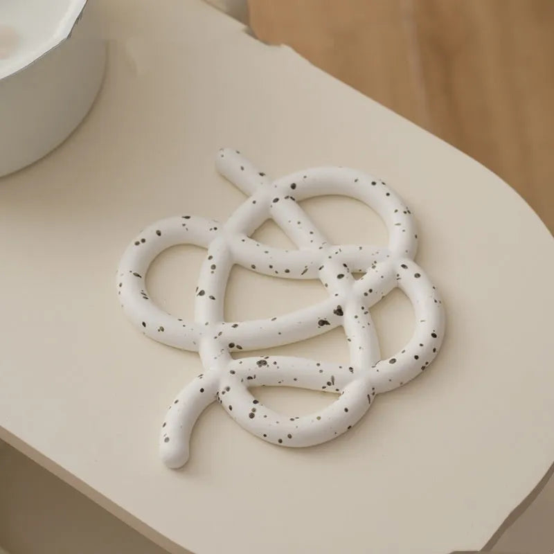 Ceramic heat proof mat in modern minimalist design with irregular shape