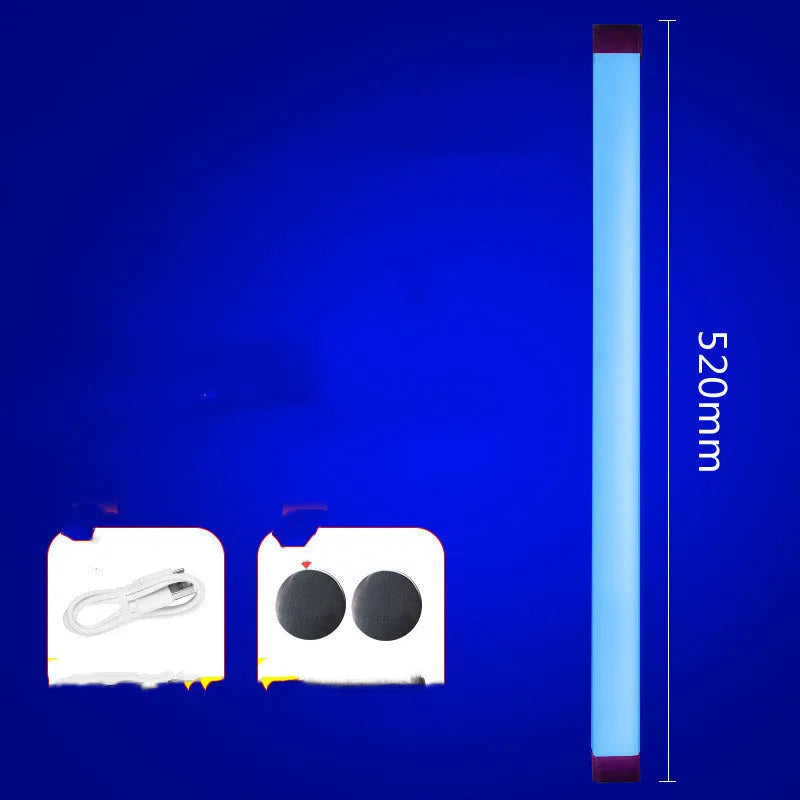 Rechargeable dimmable LED tube light in blue and purple colours shown in a bedroom setting.