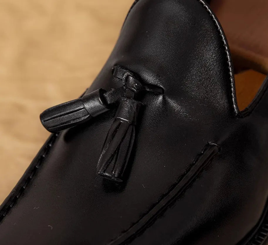 Men's black genuine leather slip-on loafers with a polished finish and rubber sole