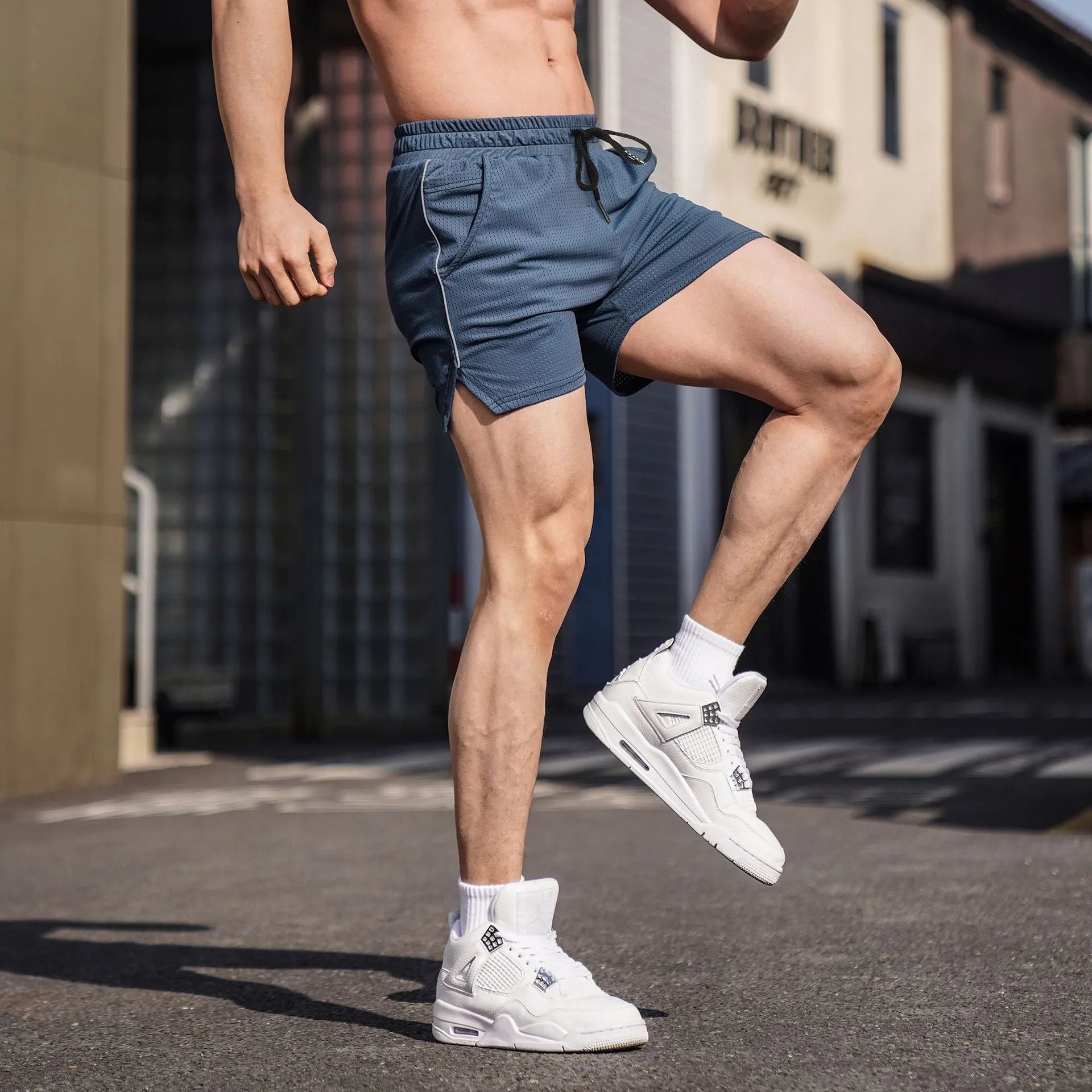 Men's straight-leg polyester sports shorts in black, available in sizes up to 3XL