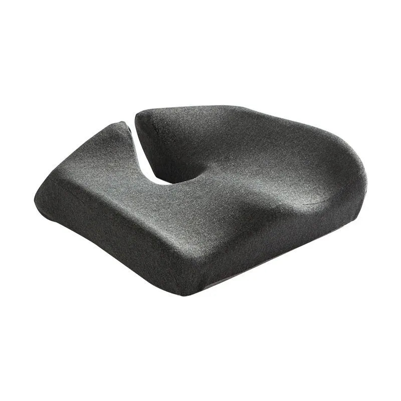 A solid grey memory foam office chair cushion for lumbar support.