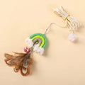 Blue feather cat rope toy hanging from a door with elastic swing and sticky buckle clamp