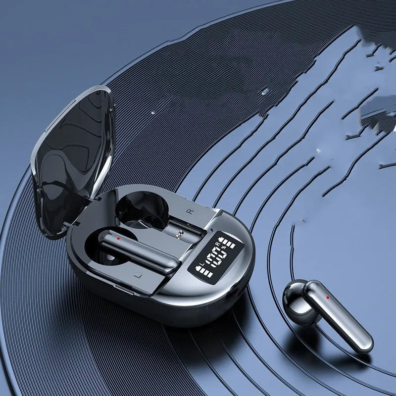 Black and white wireless Bluetooth in-ear headset with digital display screen and charging bin