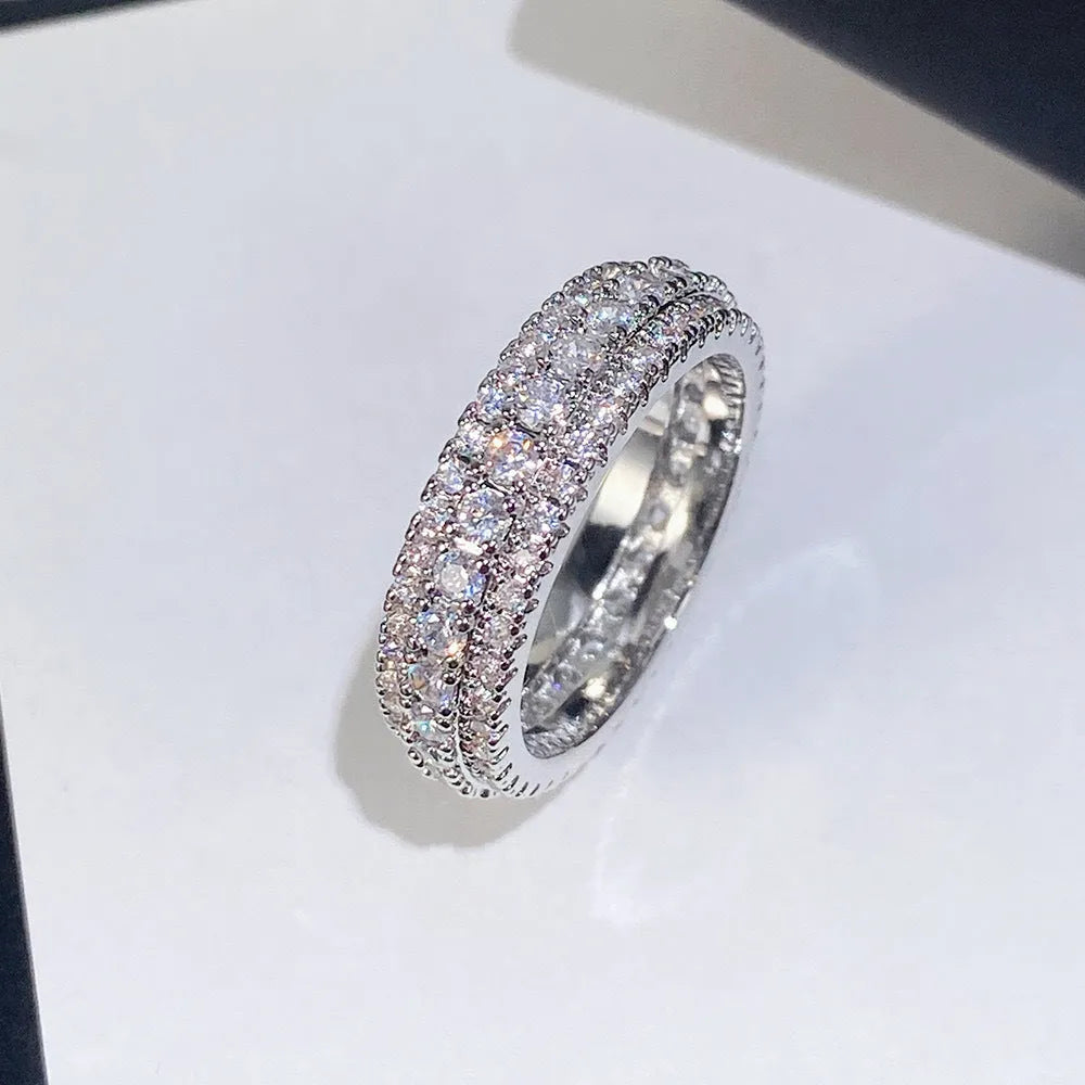 Geometric triangle zircon ring in three colour options showing detailed inlay work