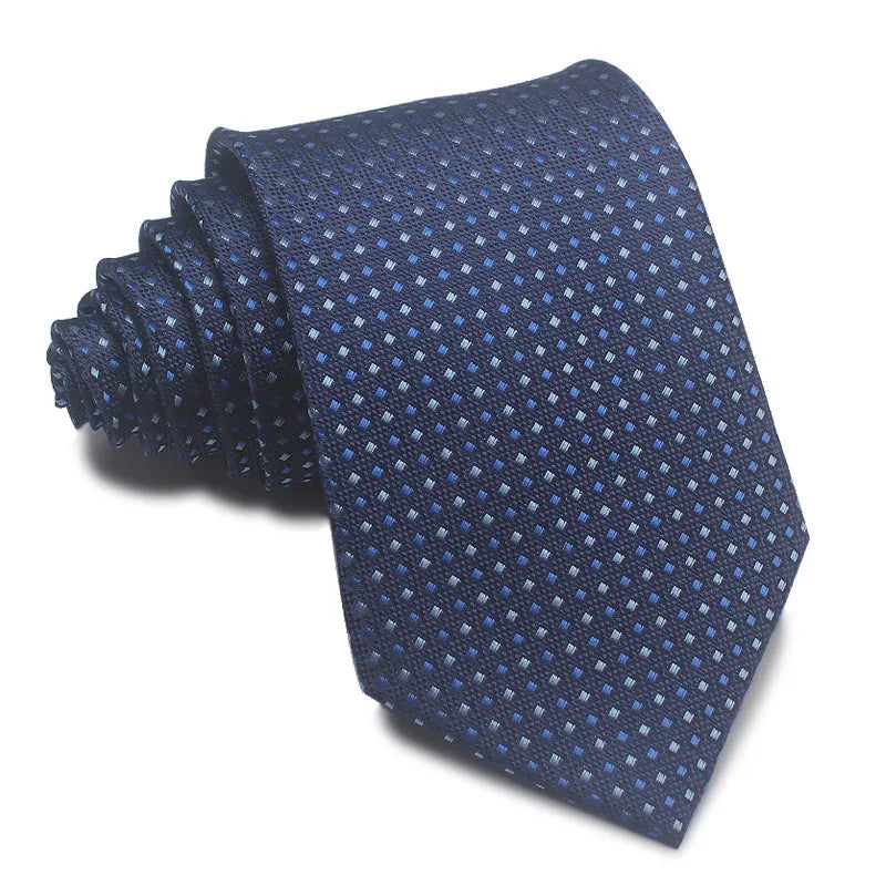 Close-up of a red, black, and blue striped men's formal tie with a textured Jacquard weave.