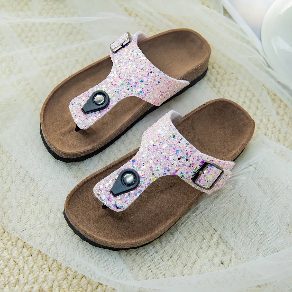 Gold frosted cork flip-flop slippers with hollow-out design and non-slip PVC sole.