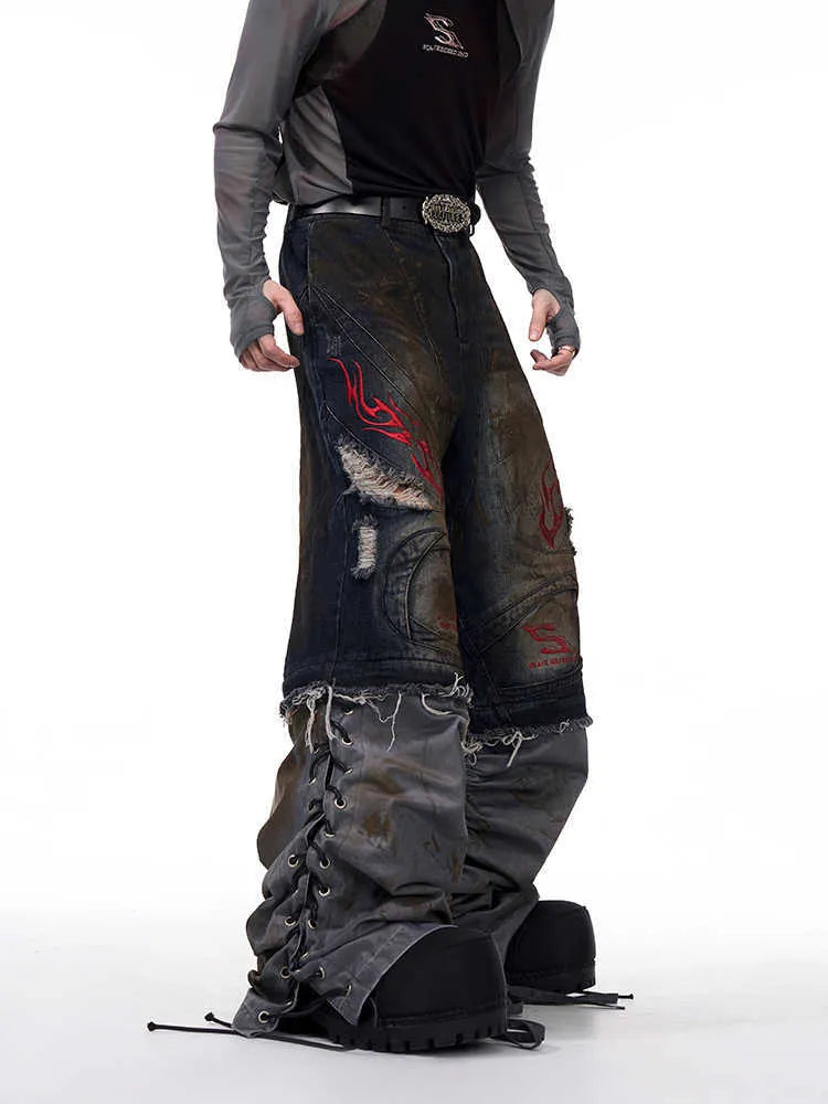 Men's light blue wide-leg jeans with detachable trouser legs shown on a hanger.
