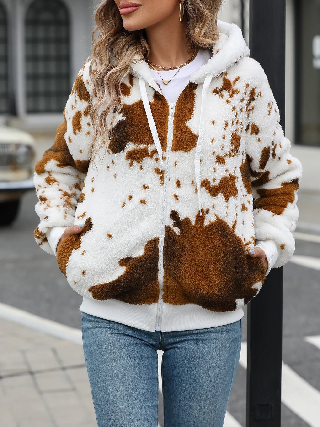 Yellow-brown hooded cardigan jacket with animal cow print pattern and zip-front closure