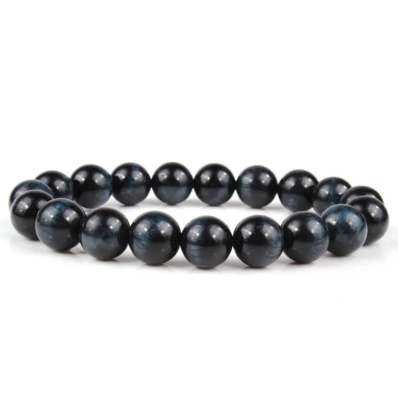 Natural tiger eye crystal beaded bracelet for men and women on a white background.