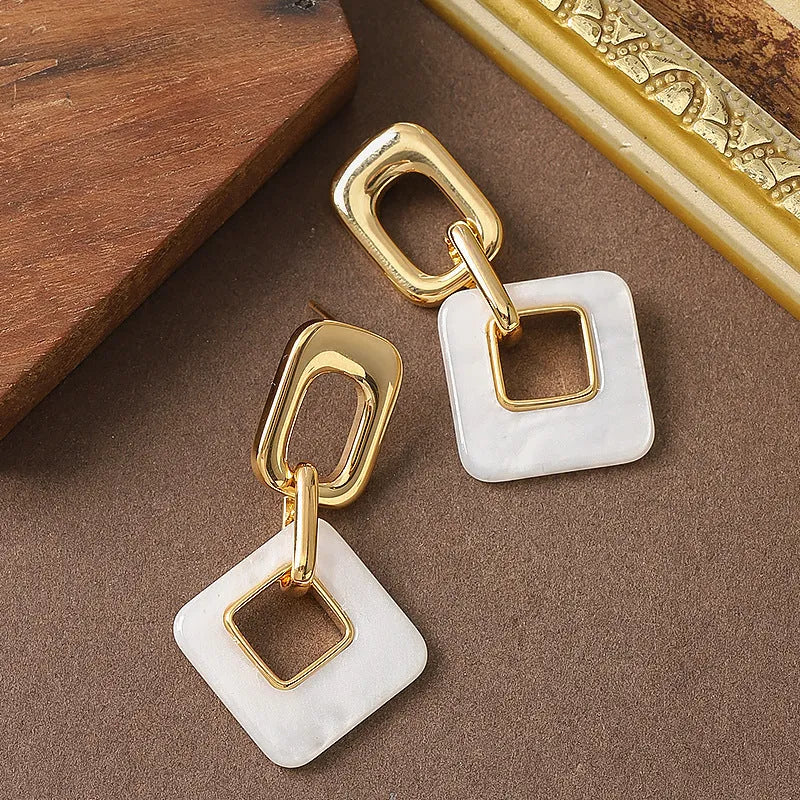 Geometric square hollow earrings with chamfered corners in electroplated copper
