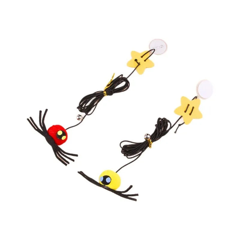 Red cat door hanging toy with elastic rope, feathers, bell, and spider attachments for interactive play