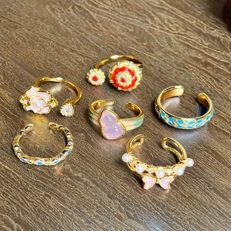 Adjustable copper gourd ring with flower and bow design in New Chinese style featuring inlaid zircon stones