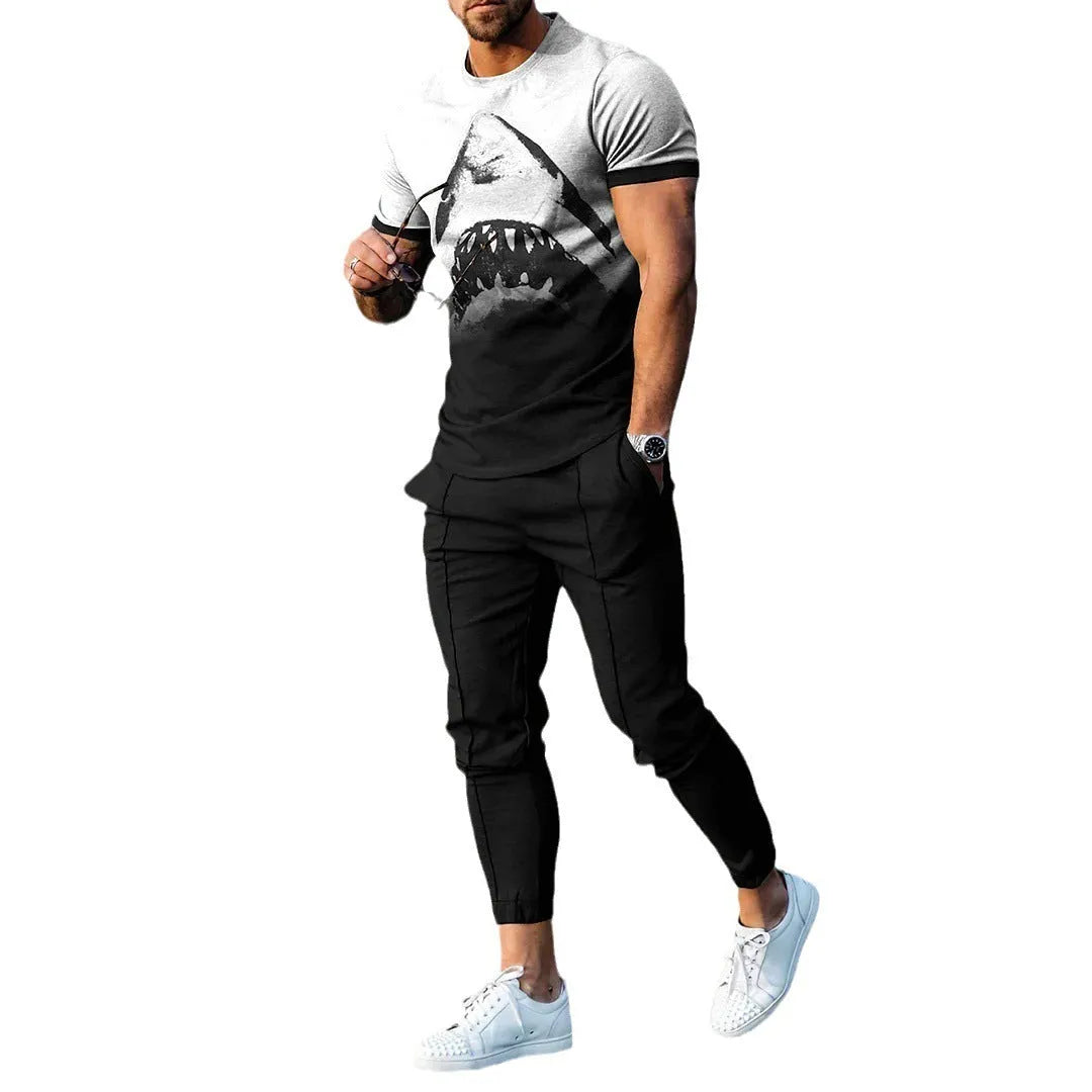 Man wearing a printed short-sleeve t-shirt and matching trousers from a cotton-like men's tracksuit set.