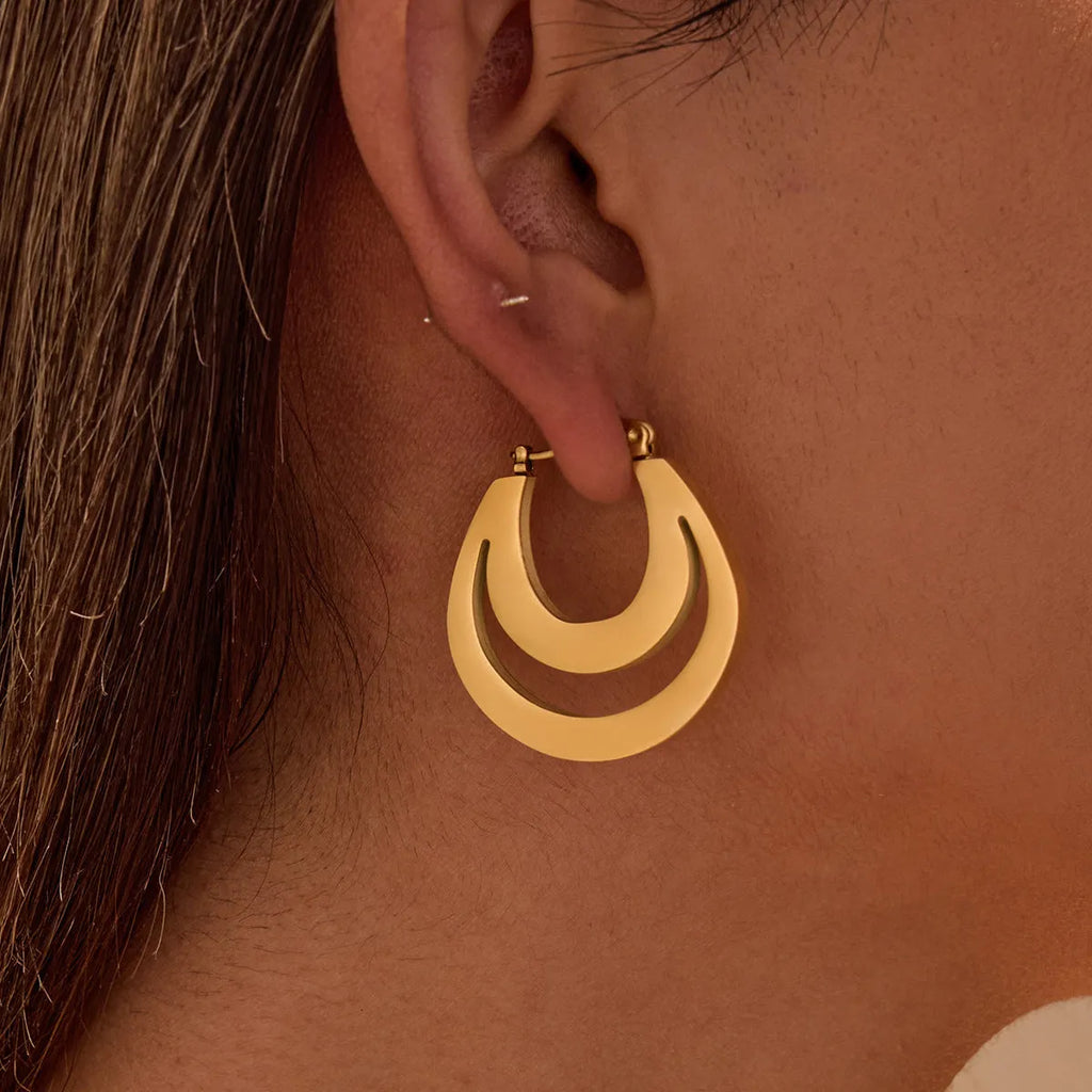A pair of women's geometric French earrings with a round ring design, available in gold or steel colour.