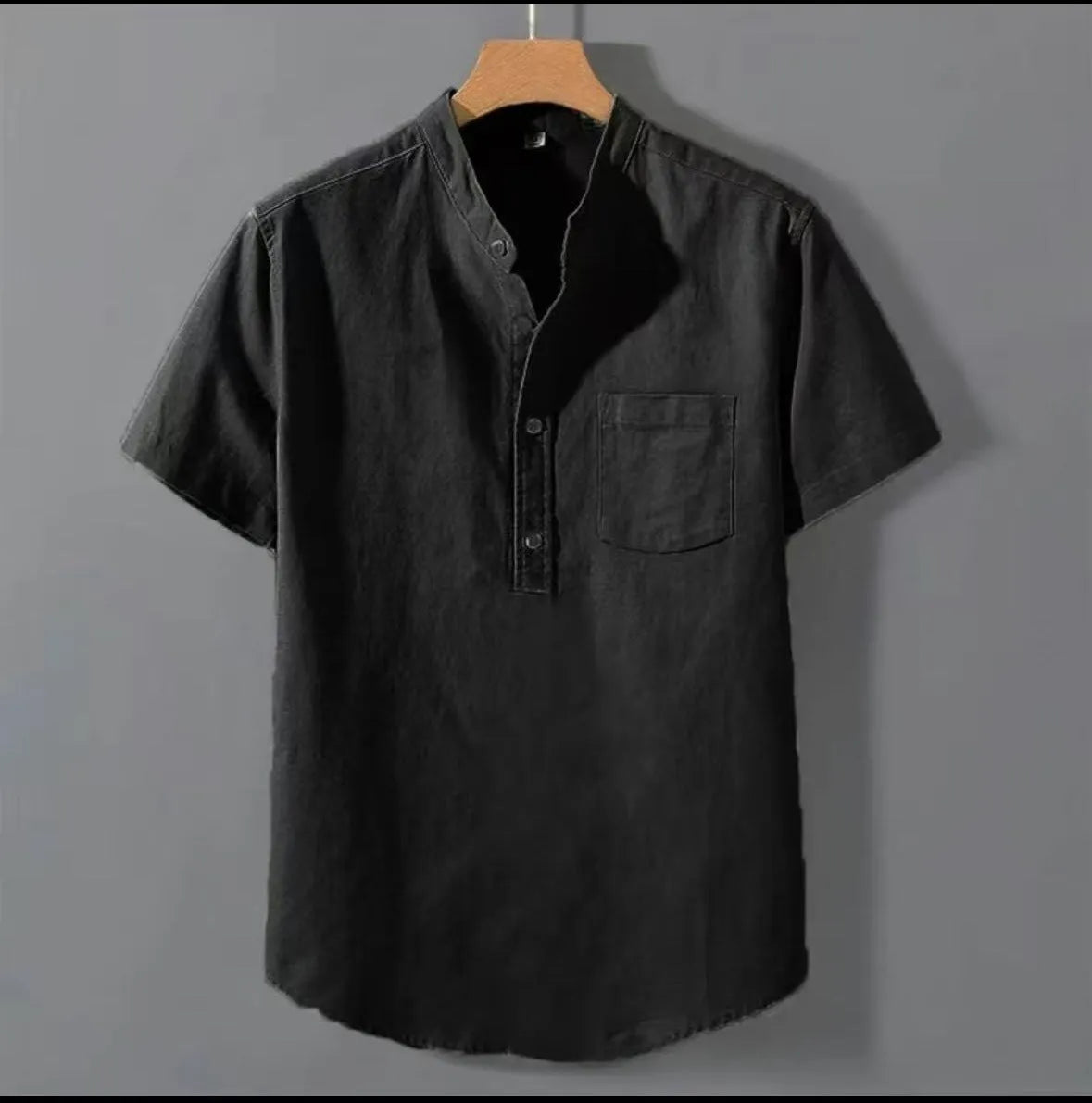 Men's casual beige linen short sleeve shirt with a stand collar and loose fit on a hanger.