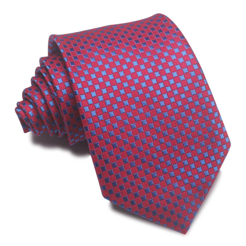 Close-up of a red, black, and blue striped men's formal tie with a textured Jacquard weave.