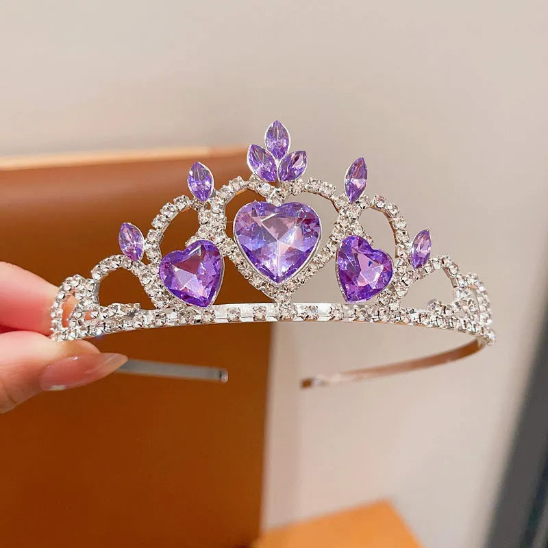 Children's metal alloy crown headdress hairband in pink, light blue, or light purple with crystal decoration.