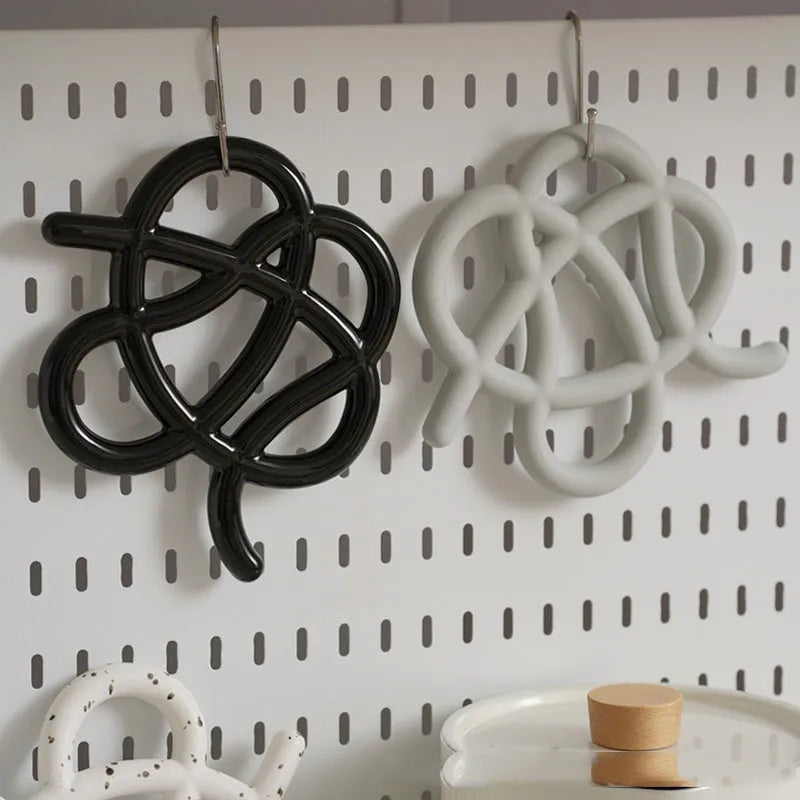 Ceramic heat proof mat in modern minimalist design with irregular shape