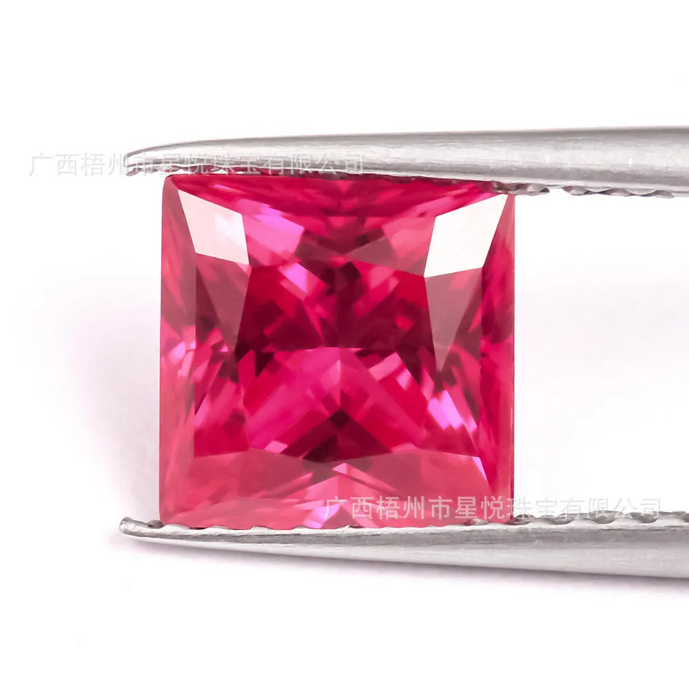Laboratory-created pigeon blood red ruby gemstone showing different cutting styles including round, princess, and water drop