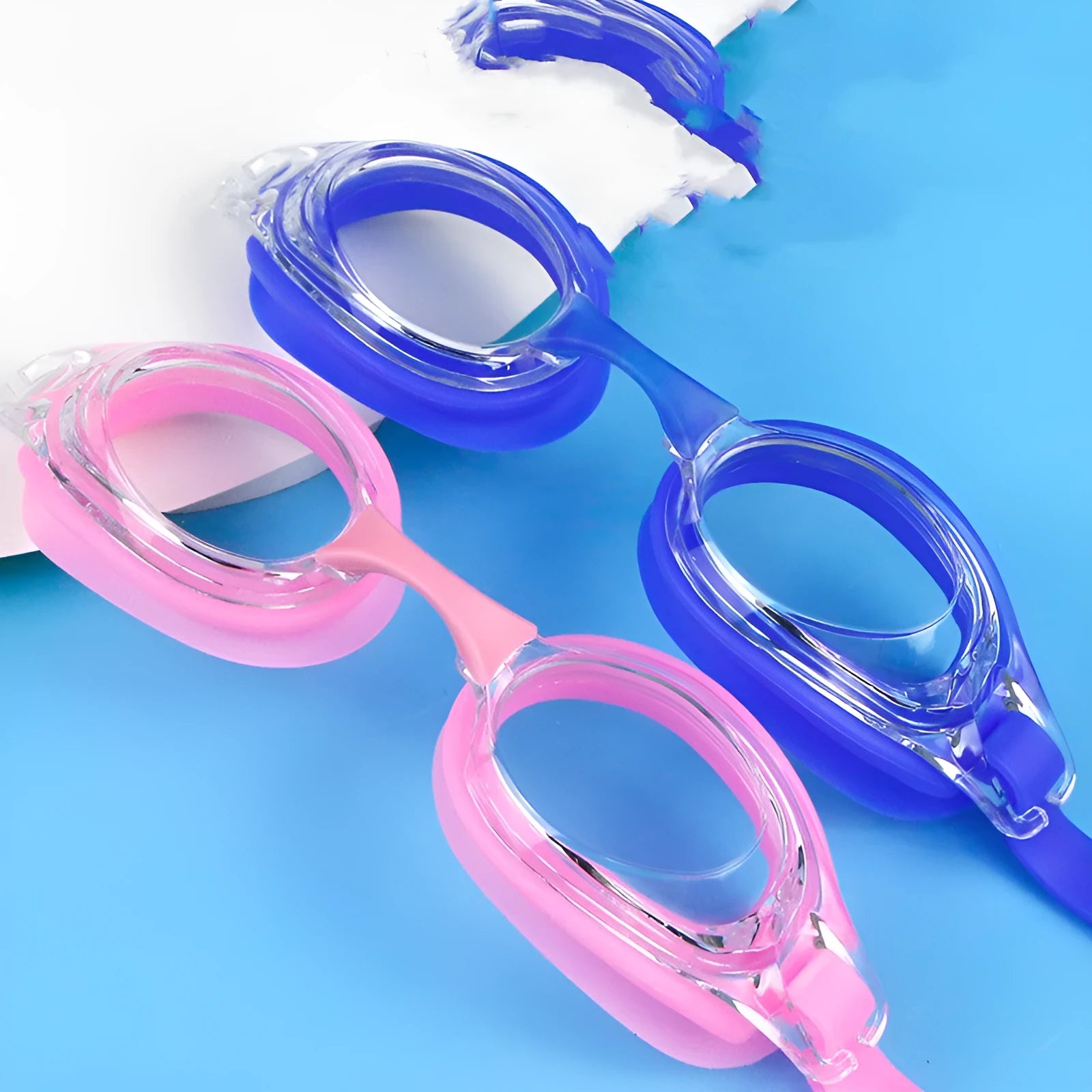 Black swimming goggles with prescription lenses and a matching case, alongside plain blue swimming goggles.