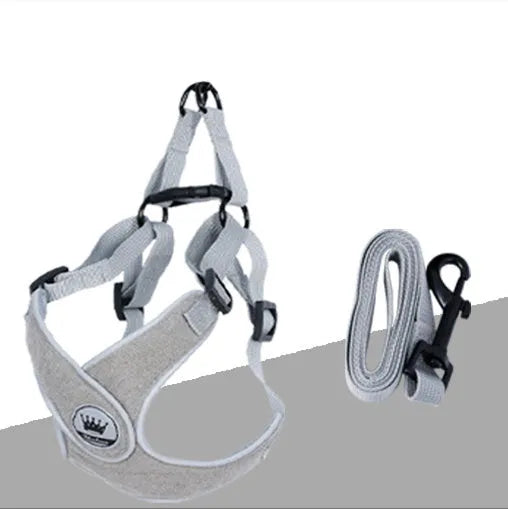 Green adjustable mesh dog harness with reflective strips and a metal leash ring, shown on a dog.