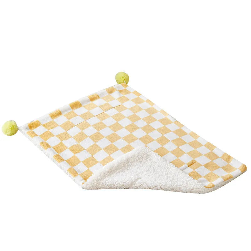 Plaid pattern pet blanket with fur ball trim on soft cotton fleece material for cats and dogs