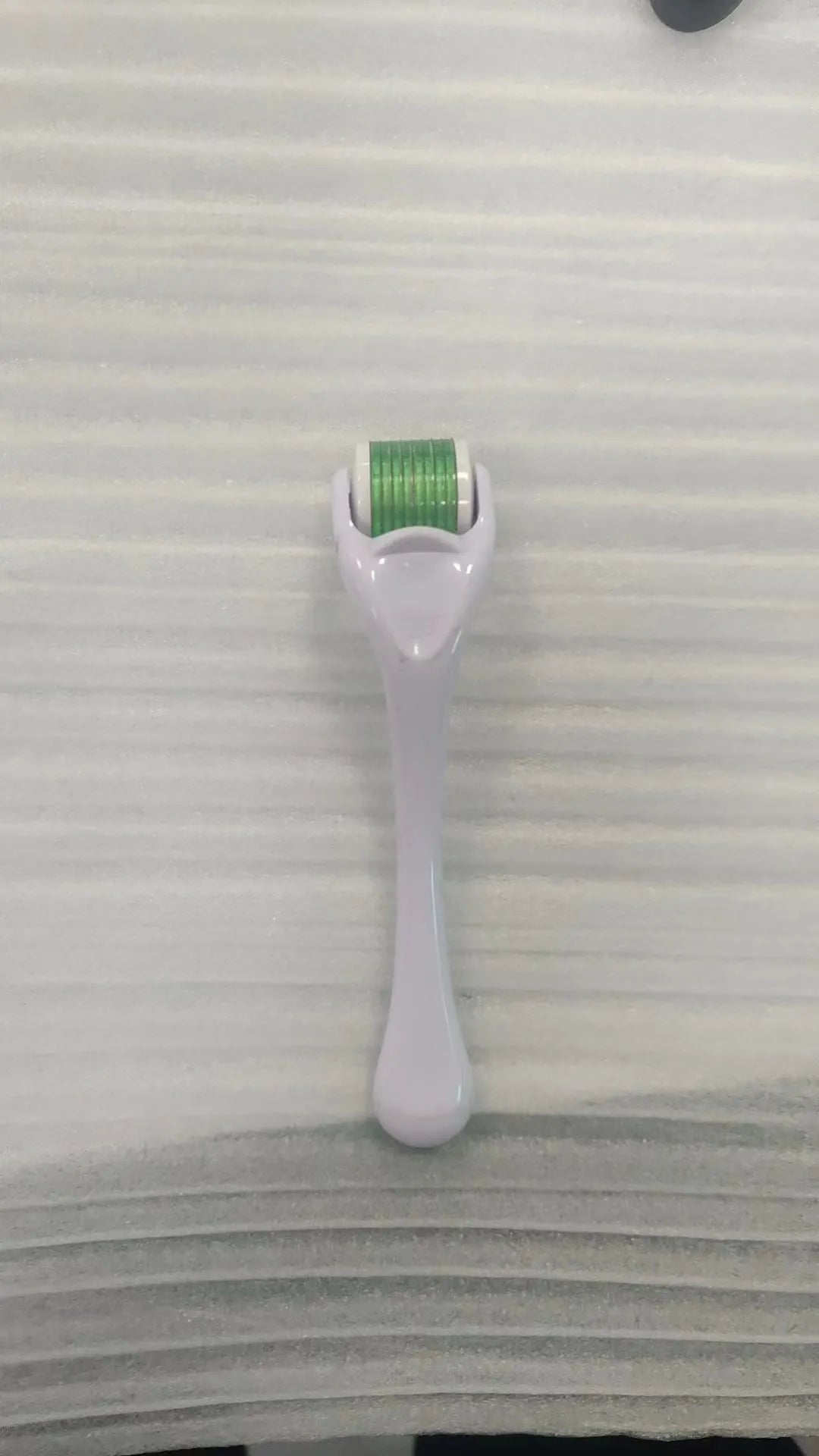 540 micro needle derma roller showing handle and needle wheel in a selected colour