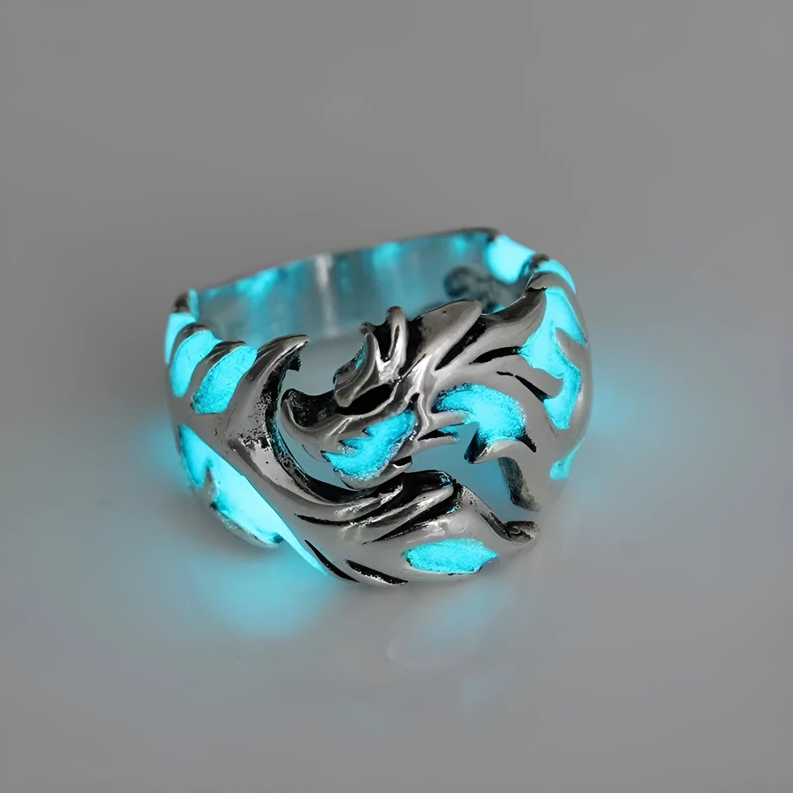 Chinese style luminous dragon pattern ring in antique silver blue and green on a metal adjustable band.