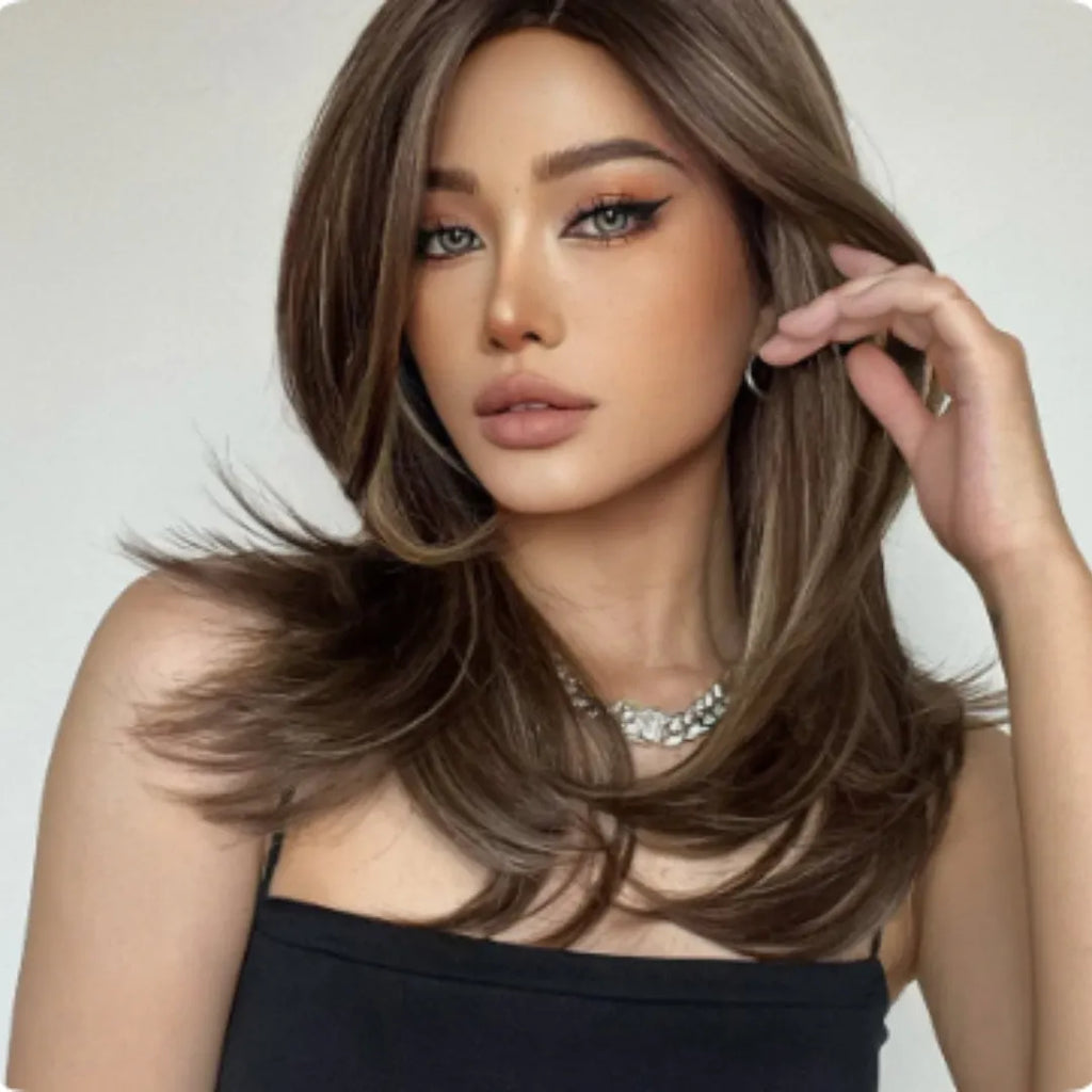 Mid-length curly synthetic wig in a gradient colour with long bangs and full-head coverage
