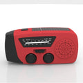 Red rechargeable hand radio torch with USB port and wrist strap on a white background.