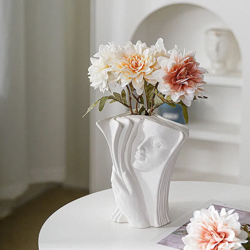 Ceramic book stand in a modern simple style with a glazed decorative pattern, holding a book upright.
