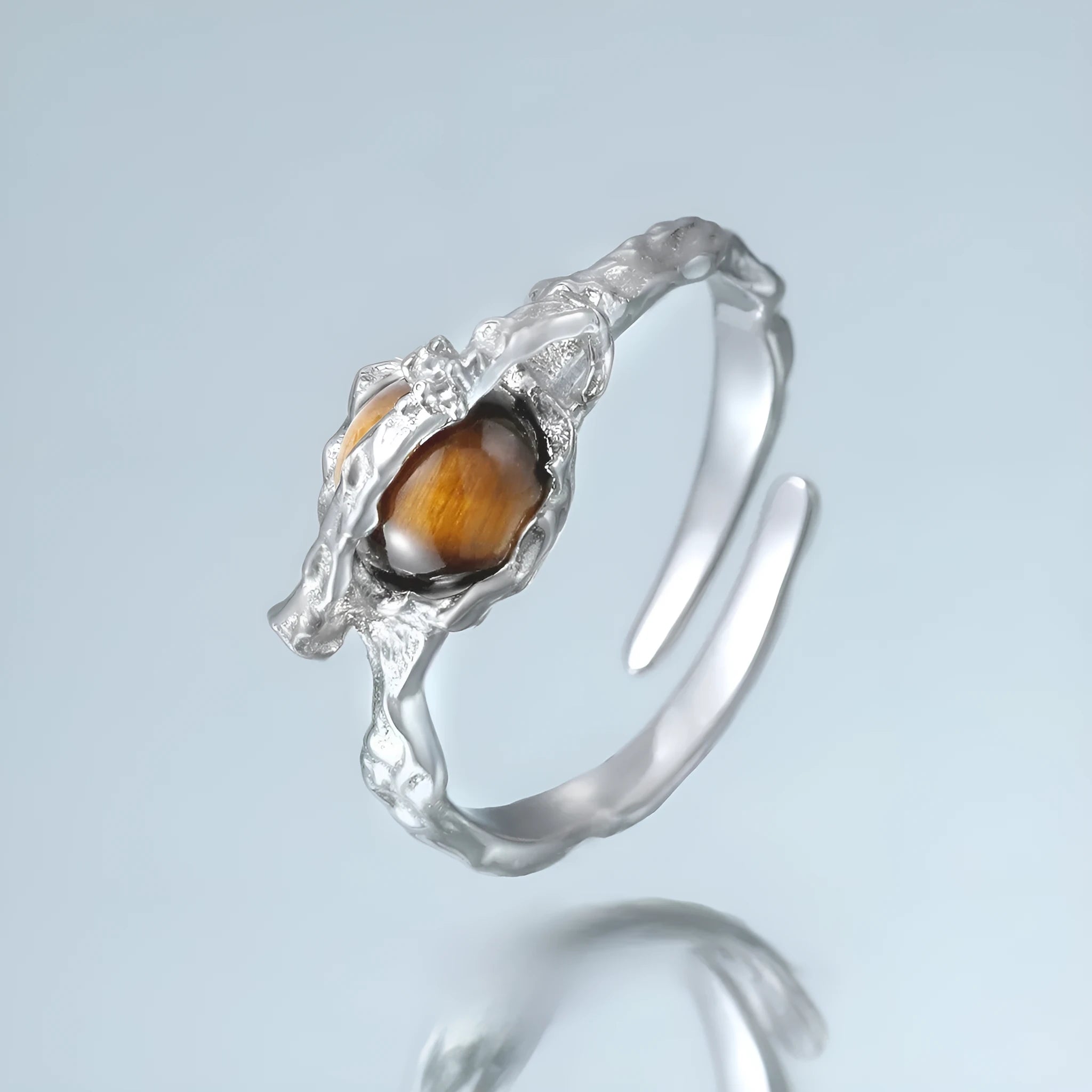 Adjustable opening Saturn ring in electroplated white gold colour with silver construction