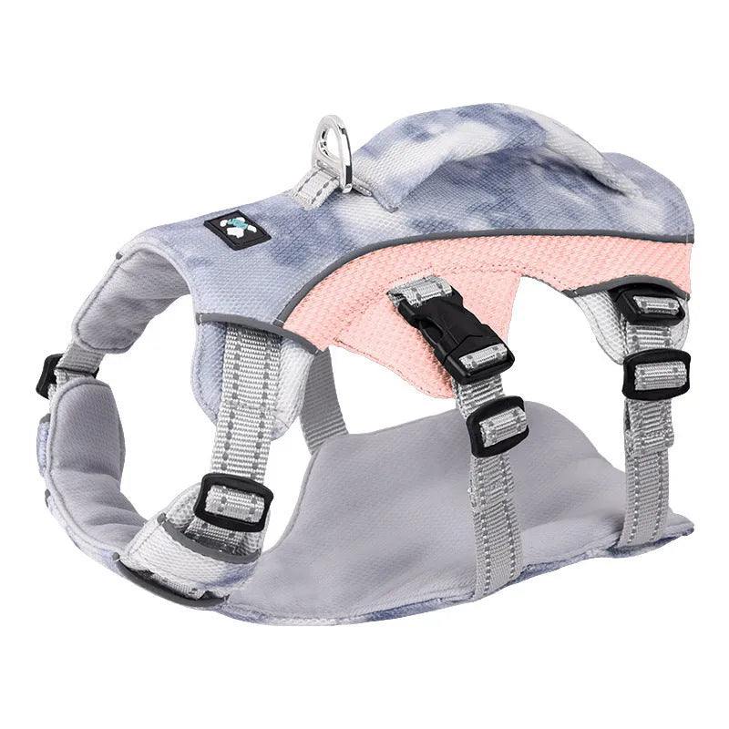 Reflective blue dog cooling vest chest strap harness with quick-release buckle on a grassy background.