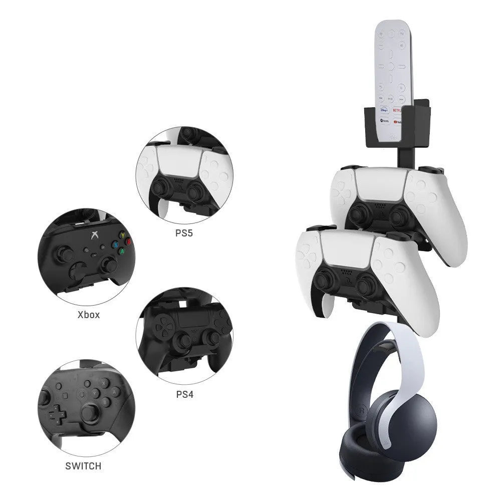 White wall-mounted hook holding PlayStation controller and headphones