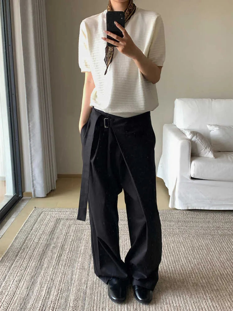 Black straight-leg trousers with a single pleat and adjustable waistband on a hanger