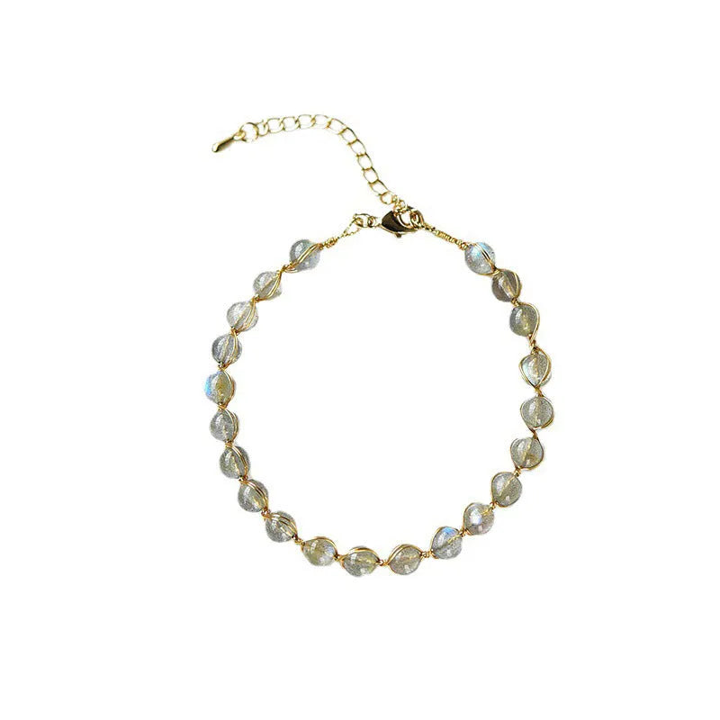 Women's blue moonstone bracelet with 6mm crystals in 14K gilded setting featuring starry sky design