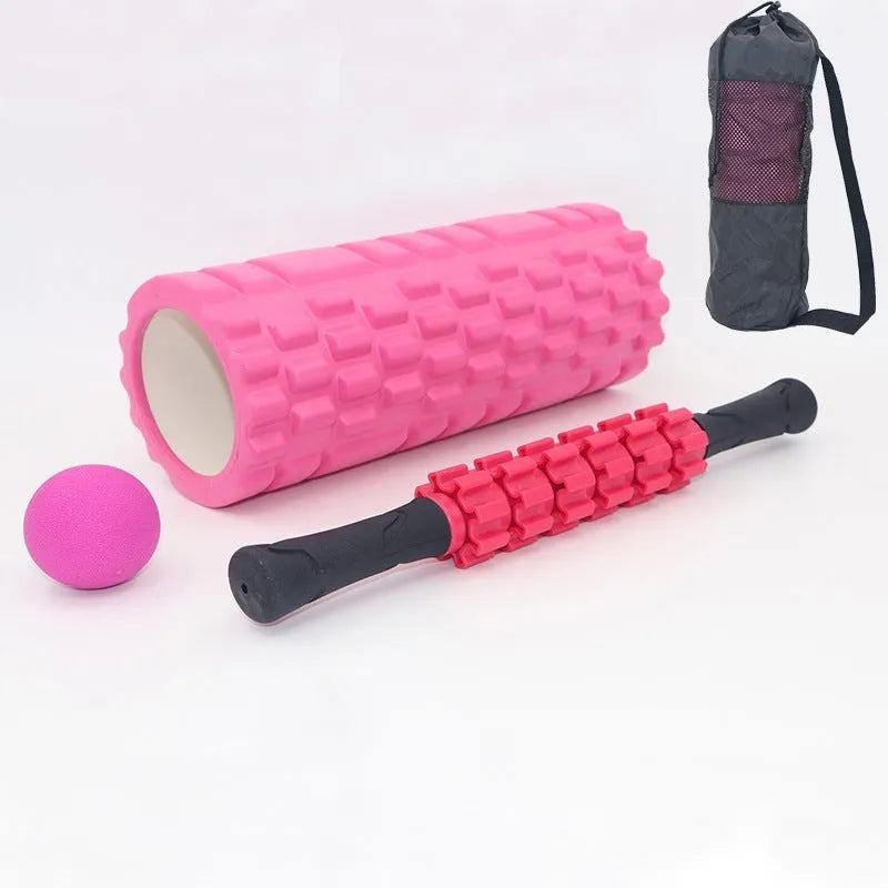 Black 33cm fitness foam roller with six gear massage bar pieces on grey background