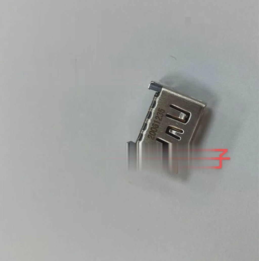 Silver-coloured HDMI host socket interface for game console repair.