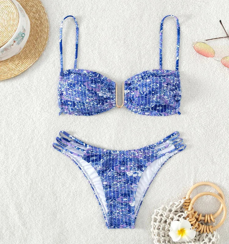 Women's high-waist floral bikini swimsuit on a hanger in blue, orange, pink, and rose red colours.