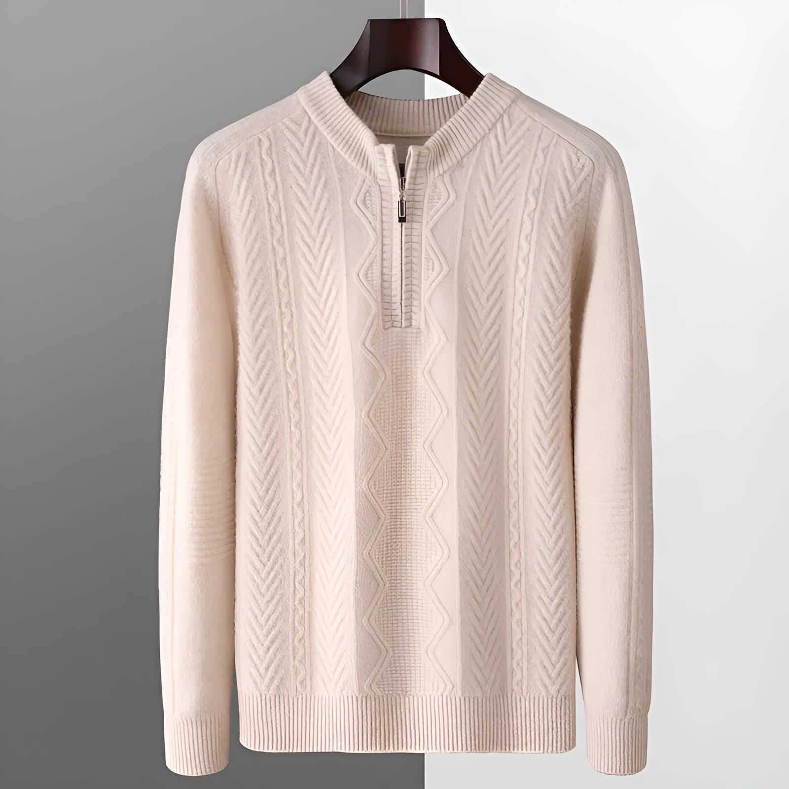 Man wearing a milky white half-zip wool sweater with a diamond pattern, showing loose fit and long sleeves.