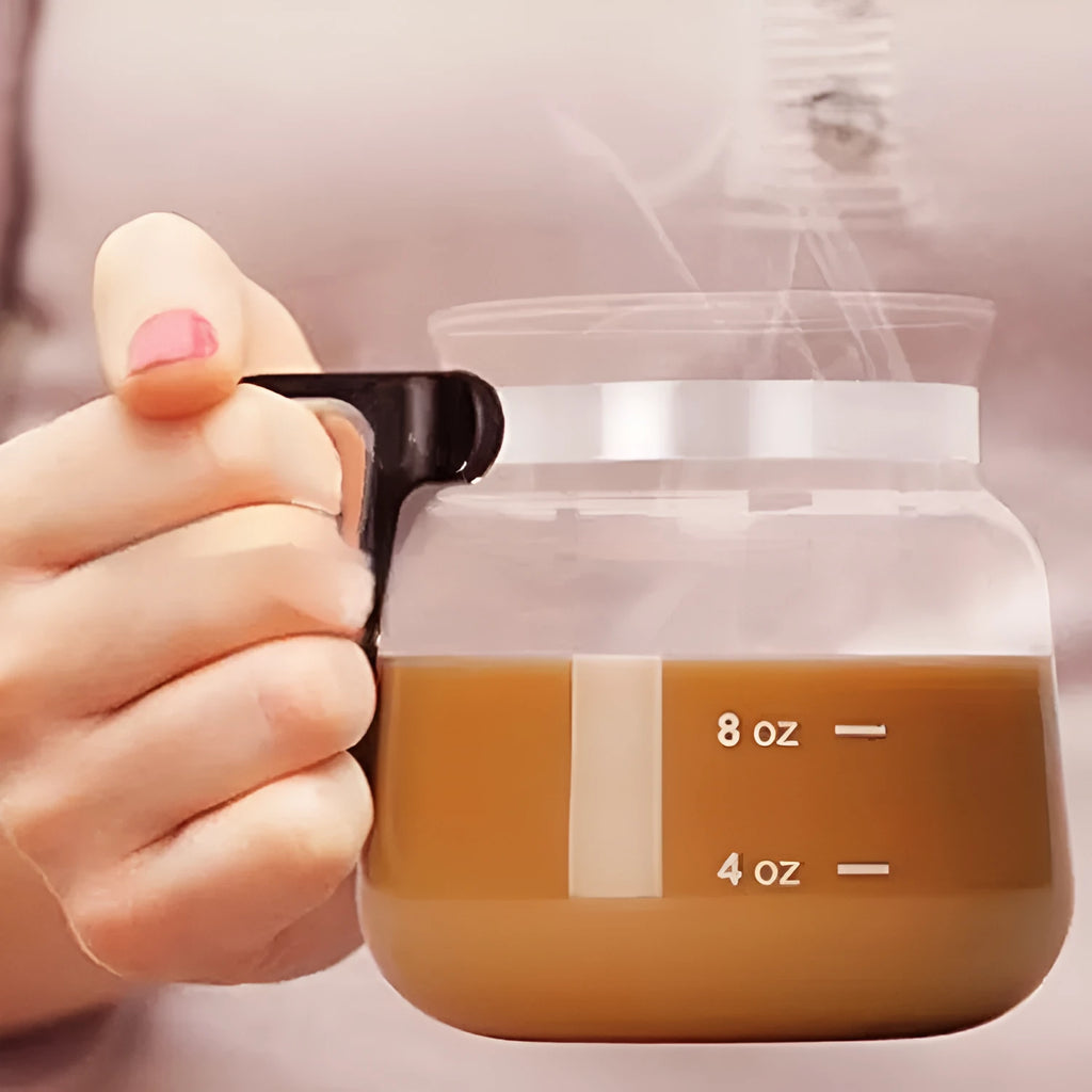 Transparent borosilicate glass coffee maker with silicone cover showing modern simplicity design
