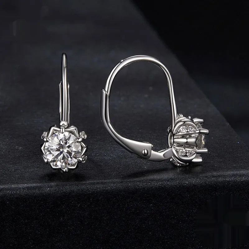 Sterling silver flower bud clip earrings with moissanite stones and white gold plating