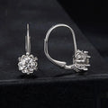 Sterling silver flower bud clip earrings with moissanite stones and white gold plating