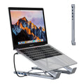 Silver aluminium alloy folding laptop stand with a built-in multi-port docking station hub.