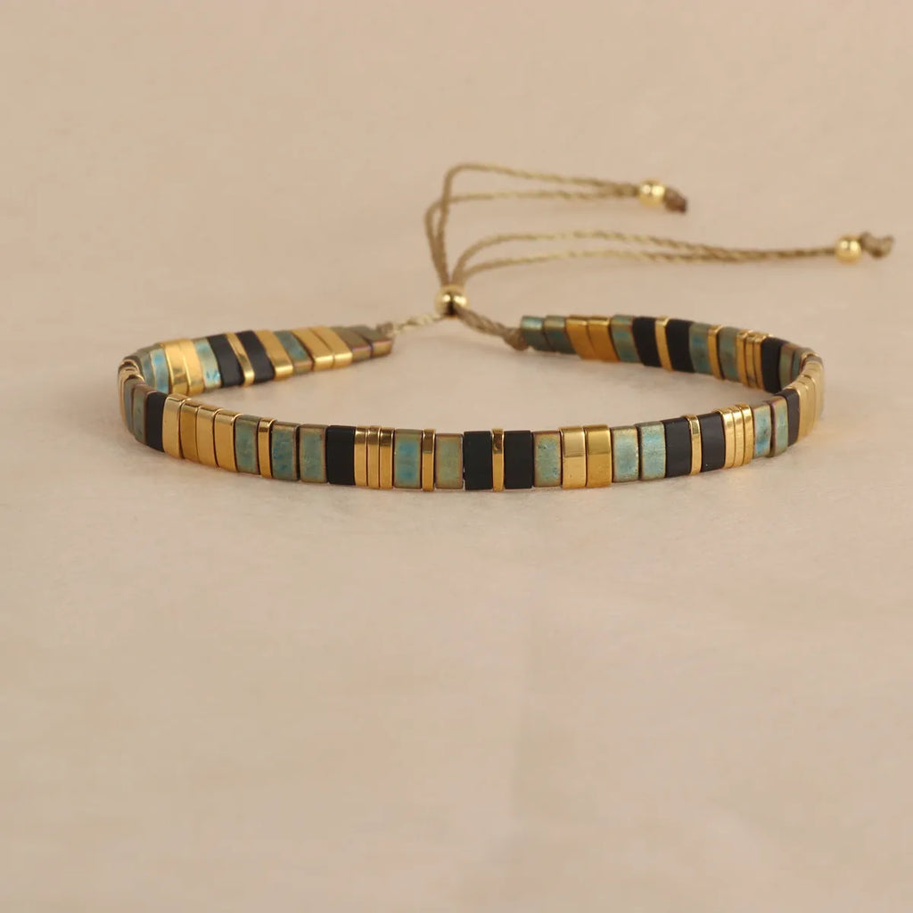 Geometric pull bead bracelet with round glass beads in multiple colour options.
