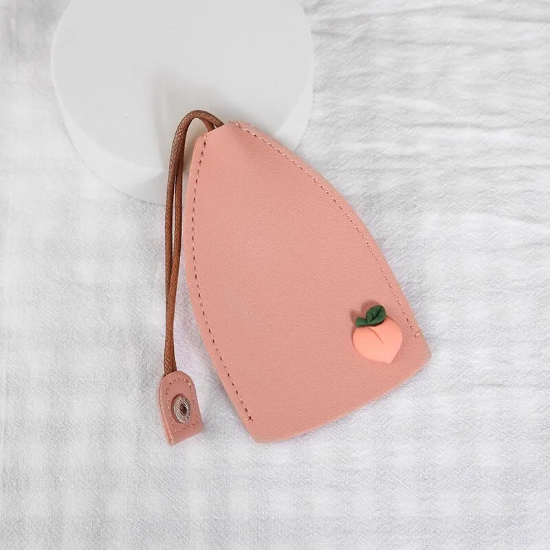 Cartoon pull-out key case in PU leather with colourful design, showing compact 14cm by 7.5cm dimensions