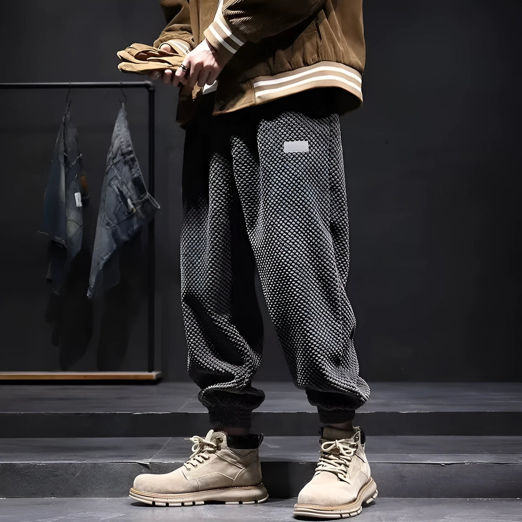 Men's grey straight leg sweatpants with an ankle-tie closure, laid flat.