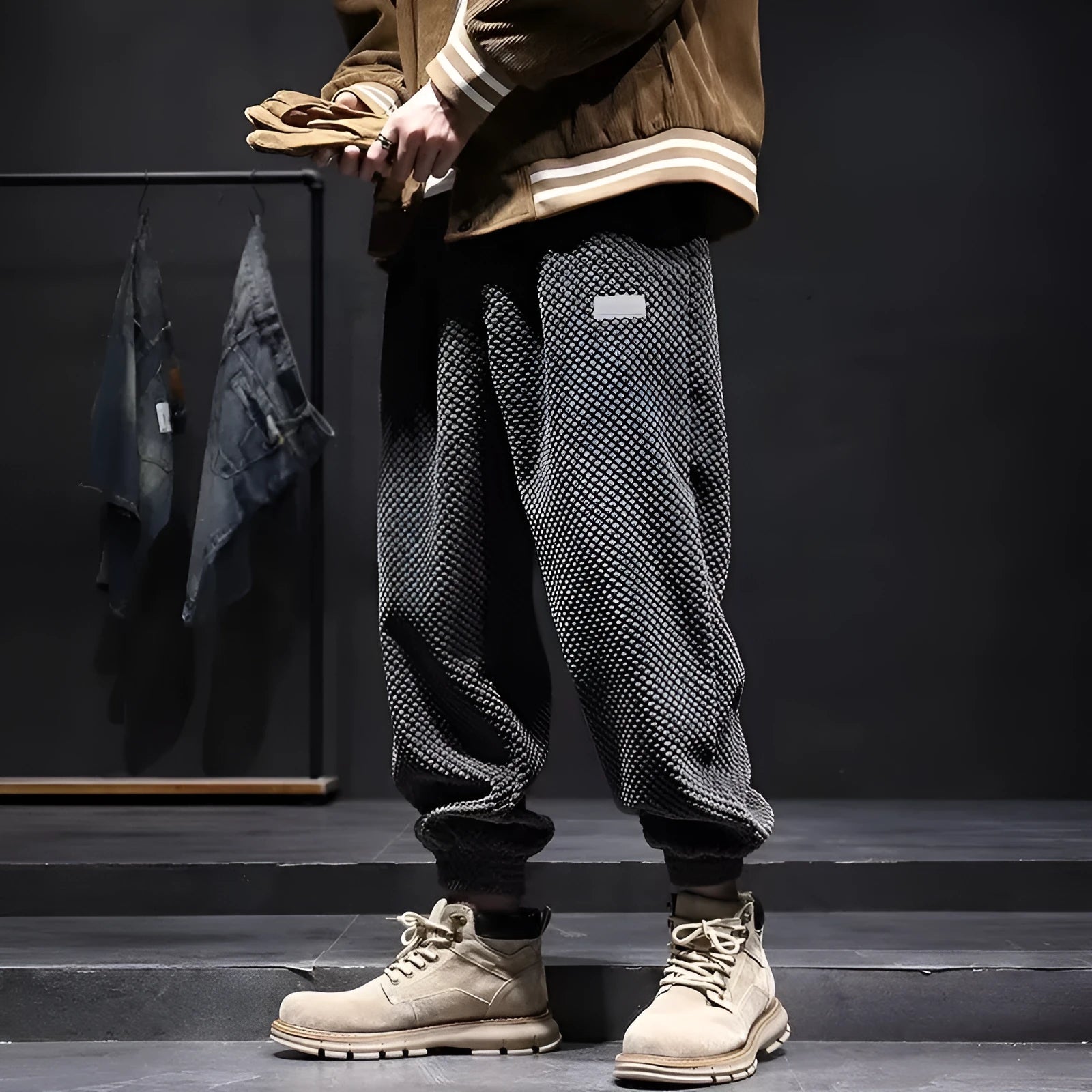 Men's grey straight leg sweatpants with an ankle-tie closure, laid flat.