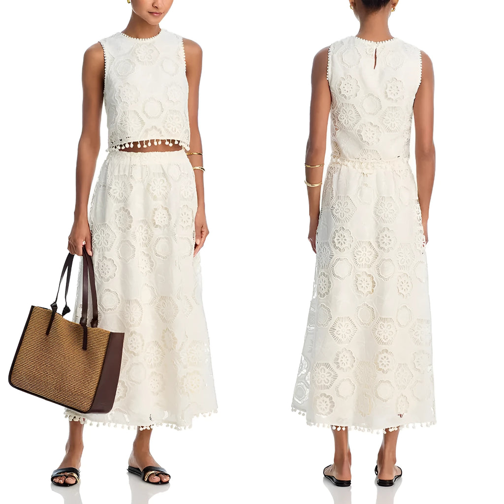 White women's retro style embroidered two-piece suit with sleeveless top and long skirt